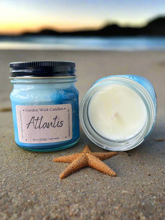 Atlantis mason jar candle with salty oceanic fragrance featuring petitgrain, ozone, sea salt, plum, eucalyptus, powder, sandalwood, and dark musk from Garden Wick