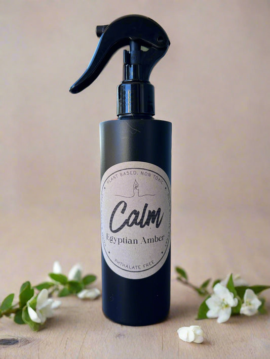 Calm Egyptian Amber 8oz room and linen spray with warm amber, leather, tonka bean, sandalwood, and musk fragrance from Garden Wick