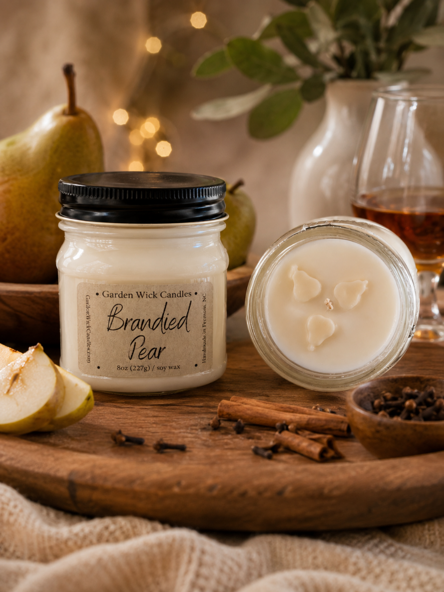 Hand-poured Brandy Pear soy candle by Garden Wick featuring the sweet aroma of juicy pear, apple, warm spices, and aged brandy.
