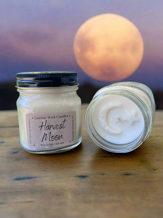 Harvest Moon 8oz mason jar candle with warm autumn fragrance featuring green leaves, pear, plum, cinnamon, sugar, smoke, and sandalwood from Garden Wick