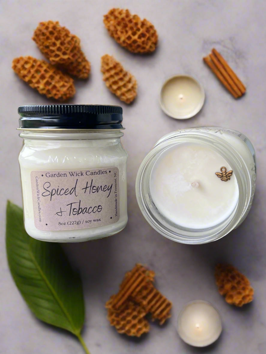 Spiced Honey & Tobacco mason jar candle with warm, spicy, and woody fragrance featuring bergamot, honey, amber, tobacco leaves, oud, tonka bean, and dark musk from Garden Wick