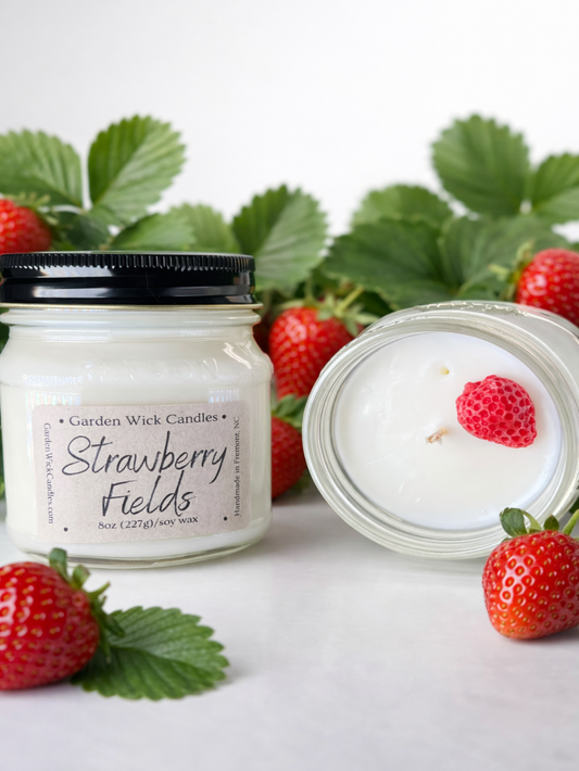 strawberry fields soy candle in mason jar by garden wick candle company featuring strawberry, passion fruit, guava, sugar, papaya, vanilla, cream fragrance.