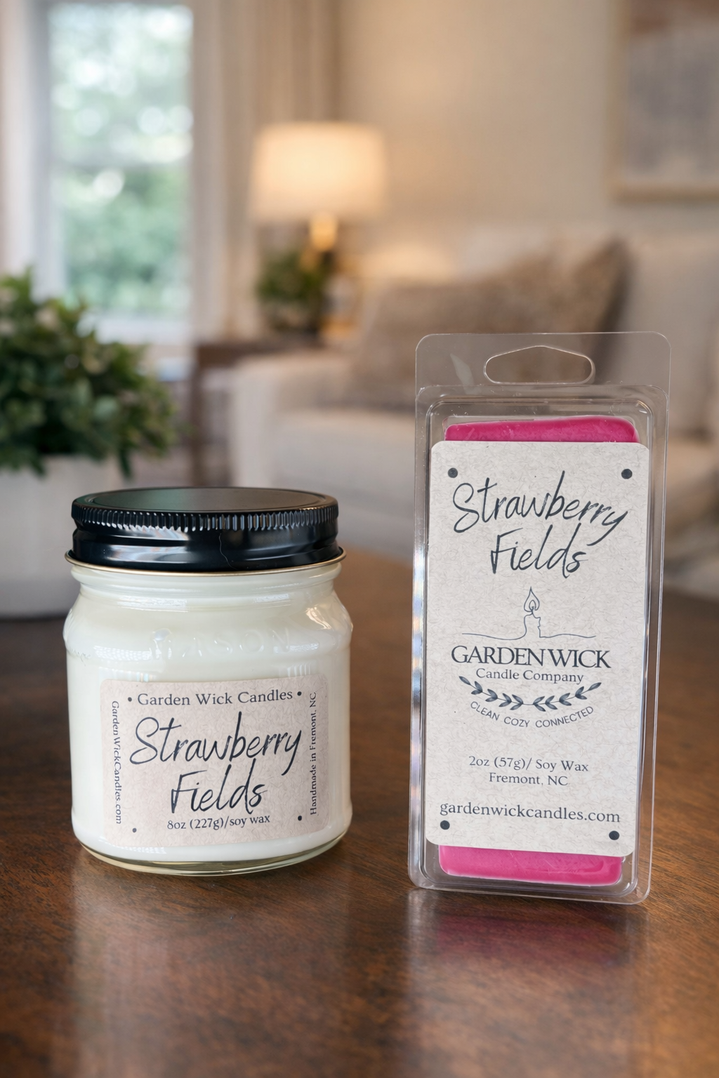 Strawberry Fields soy candle and wax melt by Garden Wick styled in a cozy home setting with a sweet strawberry, passion fruit, and vanilla cream fragrance.